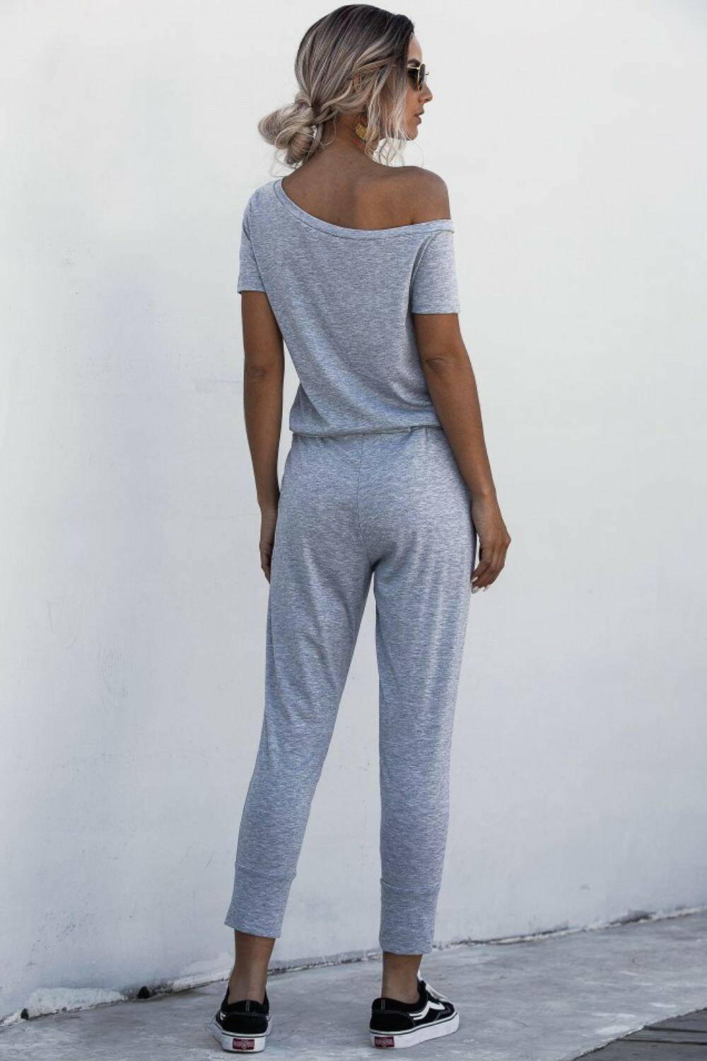 Asymmetrical Neck Tied Jumpsuit with Pockets.